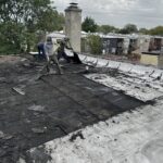 Full flat roof, chimney, and gutter residential restoration project