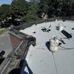 Full flat roof, chimney, and gutter residential restoration project